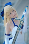 ageha blonde_hair blue_eyes choker cosplay dress elbow_gloves fate/series fate/stay_night gloves hairbow pointed_skirt saber skirt_train sword rating:Safe score:0 user:pixymisa