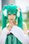 aqua_eyes bow cosplay detached_sleeves dress flower green_hair hatsune_miku headdress kai_(ii) twintails vocaloid rating:Safe score:0 user:pixymisa