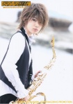 blurred_background brown_hair english_text instrument saxophone tenor_saxophone waistcoat yagami_kumi rating:Safe score:0 user:zuxvejq