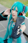 aqua_hair ayame blouse cosplay default_costume detached_sleeves hatsune_miku headset pleated_skirt skirt tie twintails vocaloid rating:Safe score:2 user:nil!
