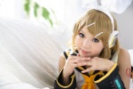 blonde_hair cosplay default_costume detached_sleeves hairbow hair_clips headset kagamine_rin kipi sailor_uniform school_uniform vocaloid rating:Safe score:1 user:nil!