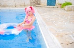 bikini_top cleavage cosplay hair_ribbons inner_tube kaname_madoka mashiro_yuki miniskirt pink_hair pool puella_magi_madoka_magica skirt swimsuit twintails wet rating:Safe score:1 user:nil!