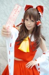aizawa_kaneko blouse cosplay detached_sleeves hairbow hakurei_reimu miko skirt touhou rating:Safe score:0 user:nil!
