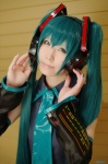 aqua_hair cosplay default_costume detached_sleeves haruka hatsune_miku headset tie twintails vocaloid rating:Safe score:0 user:nil!