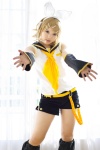 blonde_hair cosplay default_costume detached_sleeves hairbow hair_clips headset kagamine_rin kipi sailor_uniform school_uniform shorts vocaloid rating:Safe score:3 user:nil!