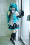 aqua_hair blouse cosplay detached_sleeves hatsune_miku headset hioron pleated_skirt skirt thighhighs tie twintails vocaloid zettai_ryouiki rating:Safe score:2 user:nil!