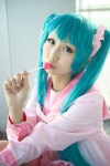 aqua_eyes aqua_hair bow cosplay dress hatsune_miku lollipop seri tiered_skirt twintails vocaloid rating:Safe score:0 user:pixymisa