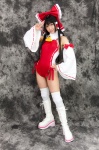 boots cosplay detached_sleeves hairbow hakurei_reimu kneepads lenfried miko one-piece_swimsuit swimsuit thighhighs touhou rating:Safe score:0 user:nil!