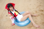 barefoot beach cosplay detached_sleeves hairbow hakurei_reimu lenfried miko one-piece_swimsuit swimsuit touhou rating:Safe score:0 user:nil!