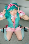 bra collar cosplay cuffs green_hair hairband kujyou_konegi macross macross_frontier ranka_lee shorts thighhighs tie vest rating:Safe score:0 user:pixymisa