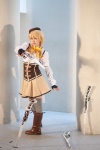 beret blonde_hair blouse boots bowtie corset cosplay detached_sleeves fingerless_gloves gloves gun miniskirt puella_magi_madoka_magica skirt thighhighs tomoe_mami twintails yoppy zettai_ryouiki rating:Safe score:0 user:pixymisa