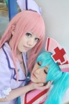 aaya aqua_hair cosplay dress hatsune_miku koiiro_byoutou_(vocaloid) megurine_luka noa nurse nurse_cap nurse_uniform pink_hair twintails vocaloid rating:Safe score:0 user:nil!