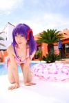 bikini cleavage cosplay fate/series fate/stay_night hair_ribbons inner_tube matou_sakura pool purple_hair sachi_budou side-tie_bikini swimsuit rating:Safe score:0 user:nil!