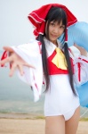 beach cosplay detached_sleeves hairbow hakurei_reimu lenfried ocean one-piece_swimsuit swimsuit touhou rating:Safe score:0 user:nil!