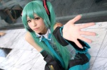 aqua_hair cosplay default_costume detached_sleeves hatsune_miku headset pleated_skirt shie skirt tie twintails vocaloid rating:Safe score:1 user:nil!