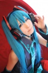 black_legwear blouse blue_hair cosplay detached_sleeves haruka hatsune_miku headset pleated_skirt skirt sleeveless_blouse thighhighs twintails vocaloid rating:Safe score:0 user:nil!