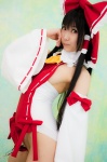 cosplay detached_sleeves hairbow hakurei_reimu handcuffs lenfried miko one-piece_swimsuit swimsuit touhou rating:Safe score:0 user:nil!