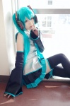 aqua_hair blouse cosplay detached_sleeves hatsune_miku headset iori pleated_skirt skirt thighhighs tie twintails vocaloid zettai_ryouiki rating:Safe score:1 user:nil!