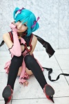 aqua_hair chii cosplay dress elbow_gloves fingerless_gloves gloves hairbows hatsune_miku project_diva stirrup_socks tail twintails vocaloid world_is_mine_(vocaloid) rating:Safe score:4 user:pixymisa