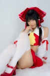 cosplay croptop detached_sleeves hairbow hakurei_reimu lenfried miko pleated_skirt skirt thighhighs touhou rating:Questionable score:2 user:nil!