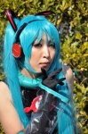 aqua_hair cosplay detached_sleeves elbow_gloves gloves hatsune_miku headphones tagme_model tie twintails vocaloid rating:Safe score:0 user:msgundam2