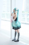 aqua_hair cosplay detached_sleeves dress hatsune_miku kneehighs microphone tagme_song twintails uni vocaloid rating:Safe score:0 user:nil!