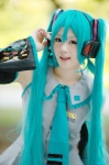 aqua_hair ayame blouse cosplay default_costume detached_sleeves hatsune_miku headset tie twintails vocaloid rating:Safe score:1 user:nil!
