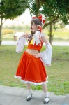 blouse cosplay detached_sleeves hairbow hakurei_reimu miko satori skirt socks touhou rating:Safe score:1 user:nil!