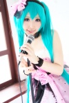 aqua_hair choker cosplay dress hairband hatsune_miku microphone momoiro_reku twintails vocaloid rating:Safe score:2 user:nil!