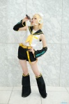 blonde_hair cosplay default_costume detached_sleeves hairbow headset kagamine_rin leg_warmers microphone shorts vocaloid yuuhi rating:Safe score:0 user:nil!