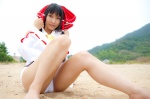 beach cosplay detached_sleeves hairbow hakurei_reimu lenfried one-piece_swimsuit swimsuit touhou rating:Safe score:1 user:nil!