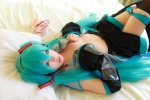 aqua_hair arai_yomi bed blouse cleavage cosplay detached_sleeves hatsune_miku headset open_clothes panties pleated_skirt skirt thighhighs tie twintails vocaloid rating:Safe score:3 user:nil!