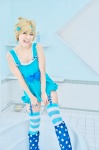 blonde_hair blue_eyes bow cosplay dress hakuhi_kaede kagamine_len leggings polka_dots striped thighhighs vocaloid rating:Safe score:0 user:pixymisa