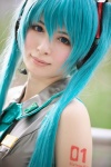 aqua_hair asami_uki blouse cosplay hatsune_miku headset tie twintails vocaloid rating:Safe score:0 user:nil!