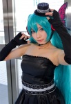 aqua_hair cleavage cosplay dress elbow_gloves fingerless_gloves gloves hatsune_miku headset strapless top_hat twintails vocaloid yane rating:Safe score:1 user:pixymisa