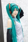 aqua_hair beng cosplay default_costume detached_sleeves hatsune_miku headset tie twintails vocaloid rating:Safe score:1 user:pixymisa