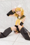 blonde_hair blouse cosplay detached_sleeves hairbow headset hiokichi kagamine_rin leggings pantyhose scarf shorts vocaloid rating:Safe score:0 user:pixymisa