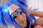 blue_hair buyara cosplay hair_ribbons headband klan_klein macross macross_frontier one-piece_swimsuit school_swimsuit swimsuit twintails rating:Safe score:0 user:nil!