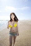 beach bikini_top cleavage denim mamoru_asana ocean shorts swimsuit vast_bust rating:Safe score:1 user:nil!