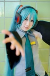 blouse cosplay detached_sleeves hatsune_miku headset pleated_skirt skirt tie twintails vocaloid yuki_nano rating:Safe score:0 user:nil!