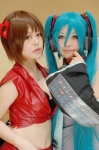 akatsuki_ayumu cosplay default_costume hatsune_miku headset meiko miniskirt nagisa_kouki skirt twintails vocaloid rating:Safe score:1 user:Log