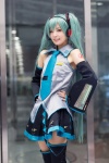 aqua_hair blouse cosplay detached_sleeves hatsune_miku headset maitako pleated_skirt skirt thighhighs tie twintails vocaloid zettai_ryouiki rating:Safe score:1 user:pixymisa