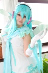aqua_hair cosplay dress elbow_gloves gloves hatsune_miku head_wings madoka_chami project_diva_2nd twintails vocaloid wings rating:Safe score:0 user:xkaras