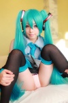 aqua_hair arai_yomi bed blouse cosplay detached_sleeves hatsune_miku headset panties pleated_skirt skirt thighhighs tie twintails vocaloid rating:Safe score:3 user:nil!