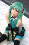 aqua_hair cosplay default_costume detached_sleeves hatsune_miku headset pleated_skirt shie skirt thighhighs tie twintails vocaloid zettai_ryouiki rating:Safe score:1 user:nil!
