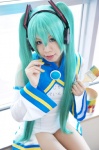 aqua_hair cosplay detached_sleeves hatsune_miku headset kuzui_azuki miracle_paint_(vocaloid) one-piece_swimsuit paintbrush pantyhose swimsuit twintails vocaloid rating:Safe score:0 user:nil!