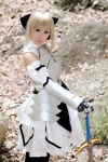 armor blonde_hair boots braid cosplay detached_sleeves dress fate/series fate/stay_night gauntlets kamui_arisa red_moon saber sword rating:Safe score:0 user:nil!