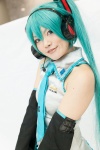 aqua_hair blouse blue_eyes chica cosplay detached_sleeves hatsune_miku headset twintails vocaloid rating:Safe score:0 user:pixymisa