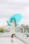 aqua_eyes aqua_hair blouse capri_pants cosplay hatsune_miku rain twintails umbrella vocaloid wristband yuuki_mio rating:Safe score:2 user:pixymisa