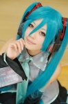 akatsuki_ayumu aqua_hair cosplay default_costume detached_sleeves hatsune_miku headset pleated_skirt skirt tie twintails vocaloid rating:Safe score:0 user:nil!